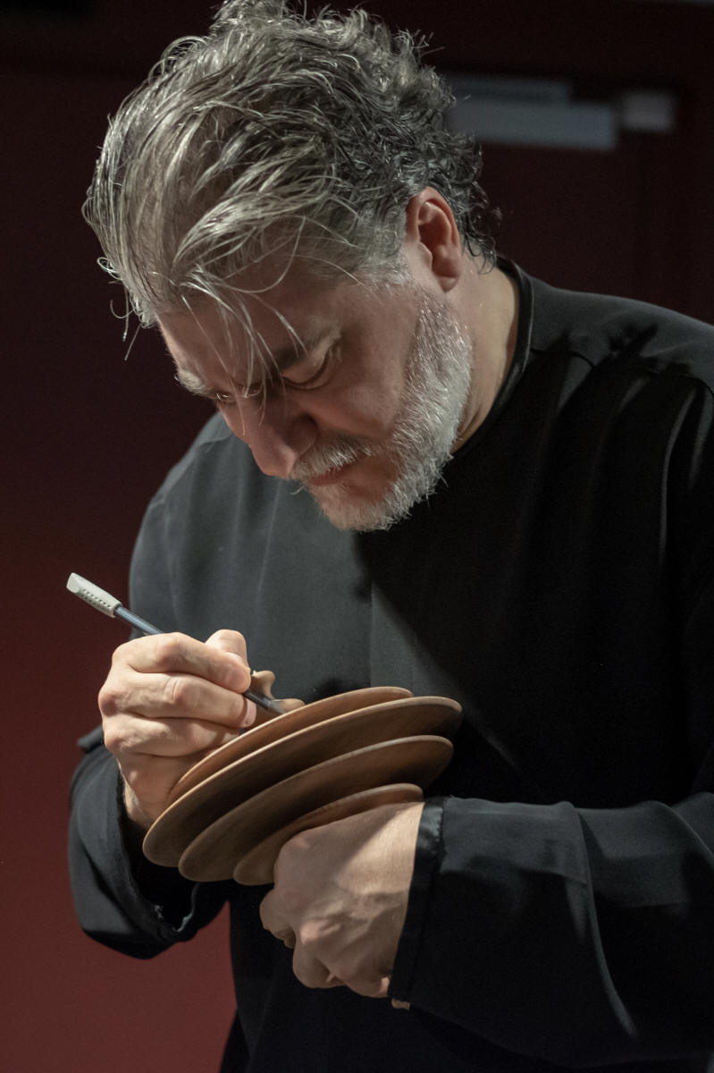 Jos Cura signs a sound sculpture for charity in Budapest, 2019.